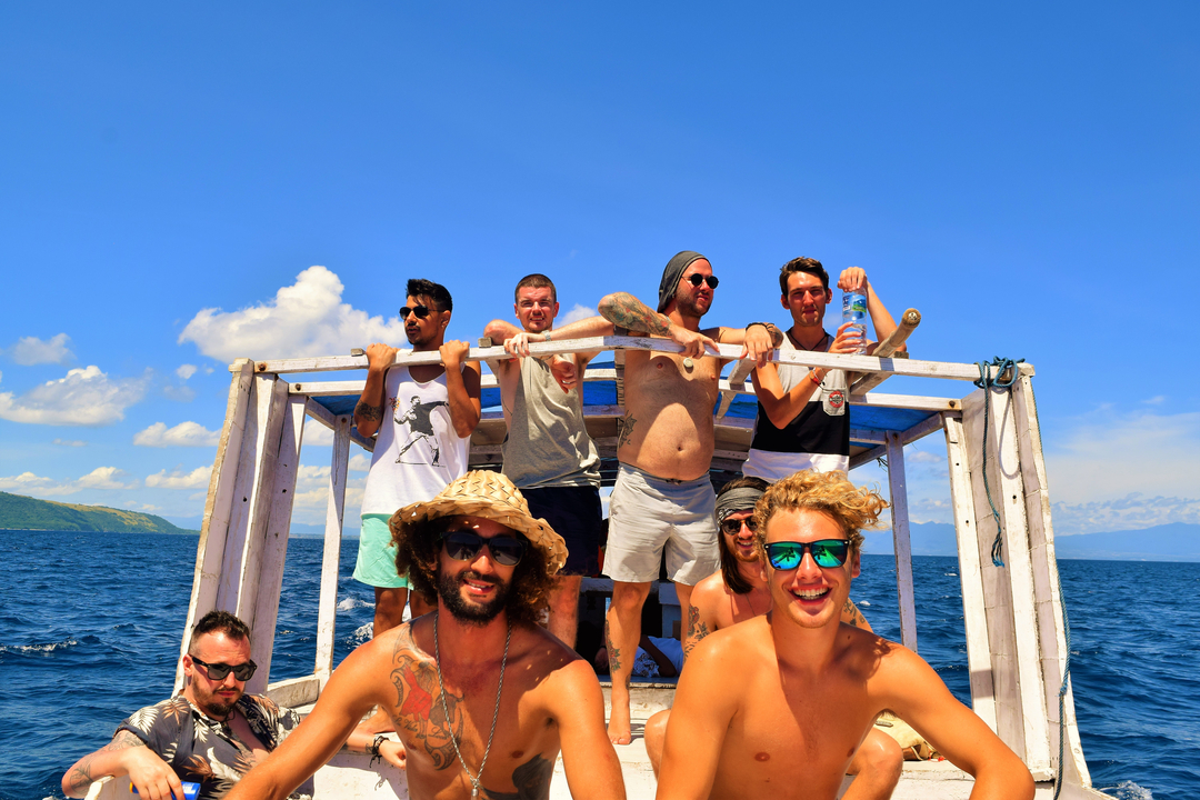 A group of people on a boat enjoying a sunny day.