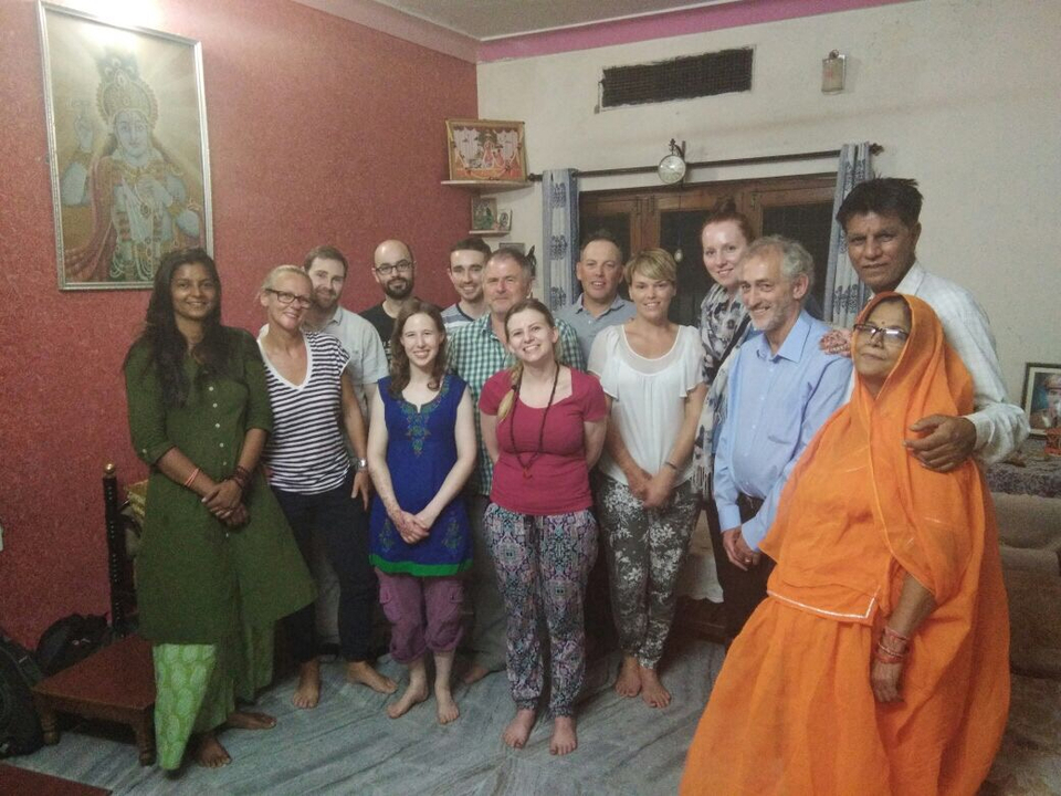 Group of people indoors, posing together.