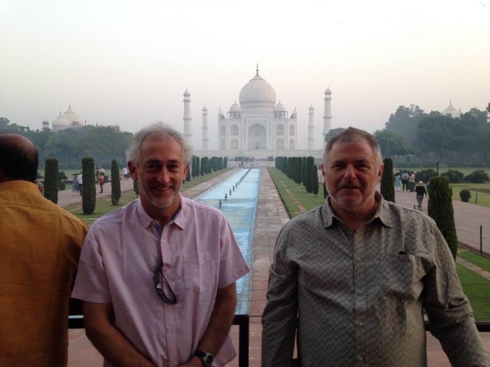 Two men posing in front of the Taj Mahal