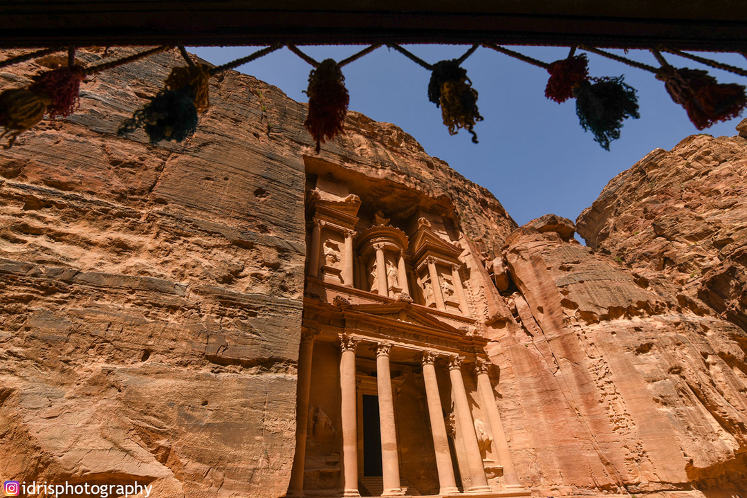 The Treasury at Petra framed by tassels.