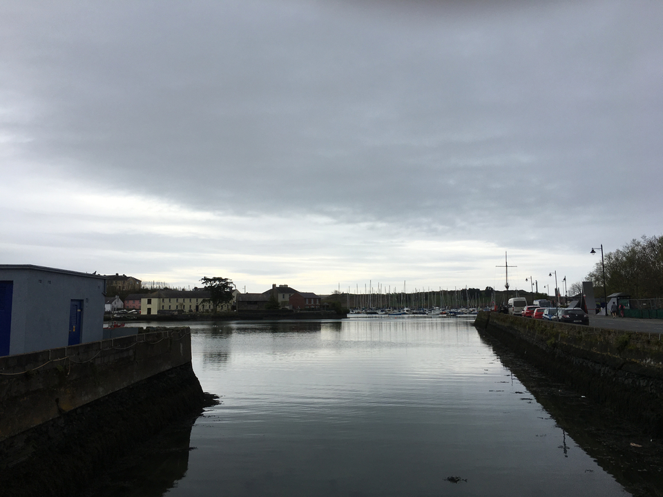 Harbor view with boats under overcast sky.