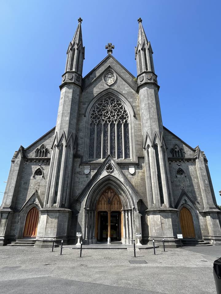 Grand church facade with detailed stone carvings.