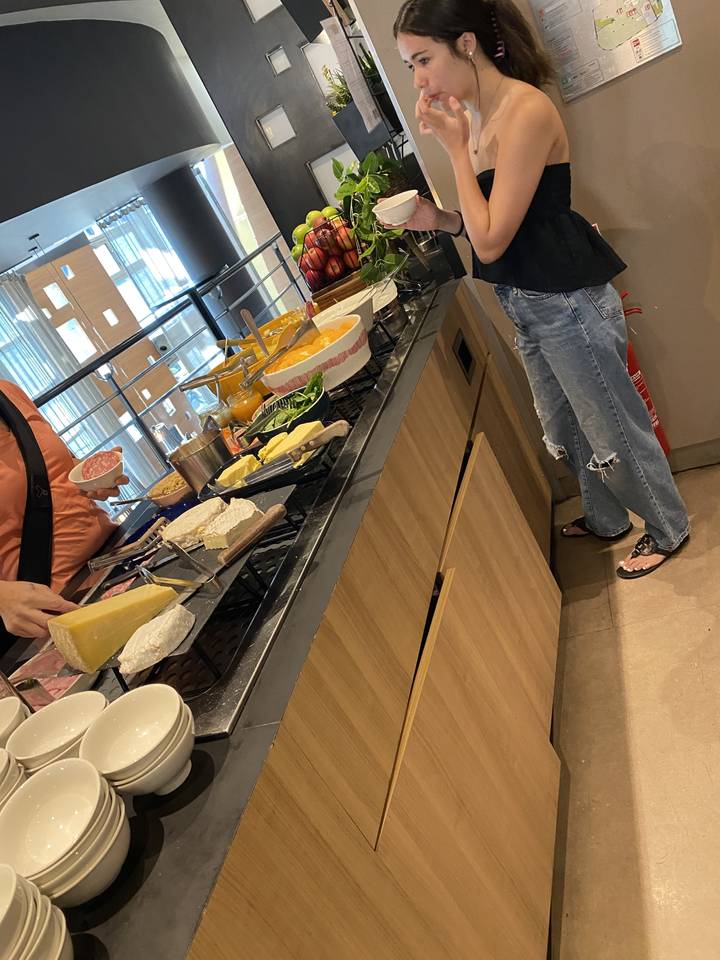 Person at a buffet enjoying a meal selection.