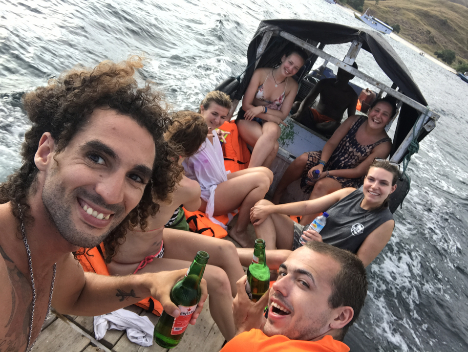 Group enjoying drinks on a boat trip.