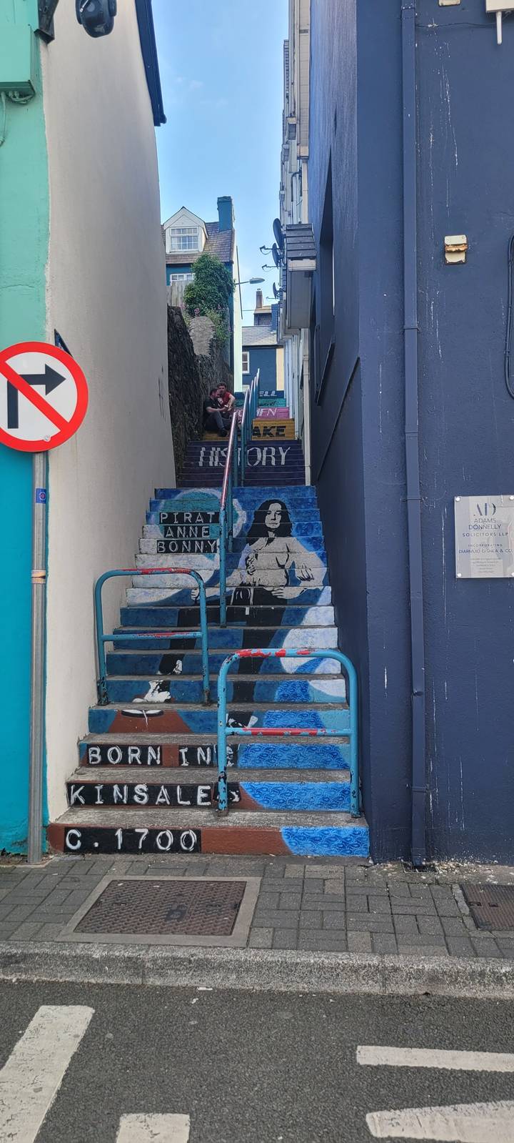 Mural painted on building steps, highlighting Kinsale history.