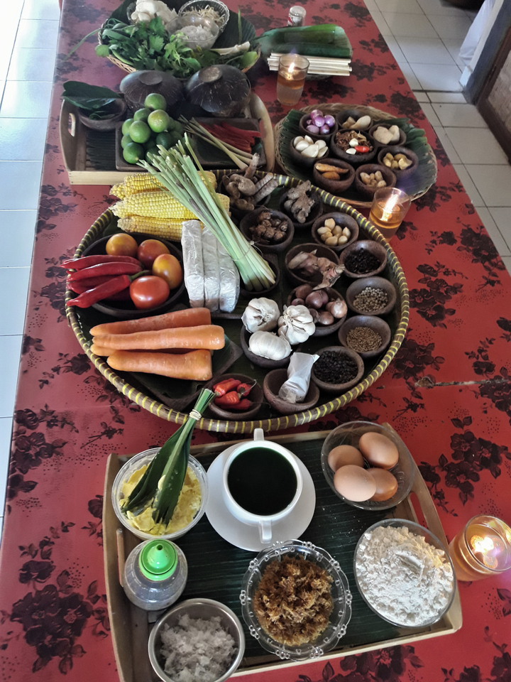 A platter with various vegetables and spices.