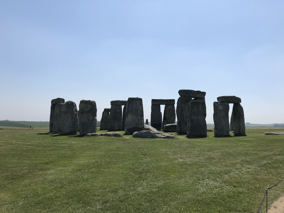 The iconic prehistoric monument, Stonehenge, under a clear sky.
