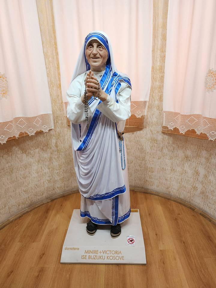 Statue of a religious figure in a museum setting.