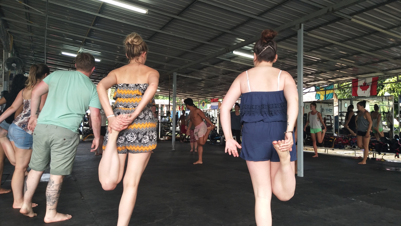 People engaging in a stretching exercise.