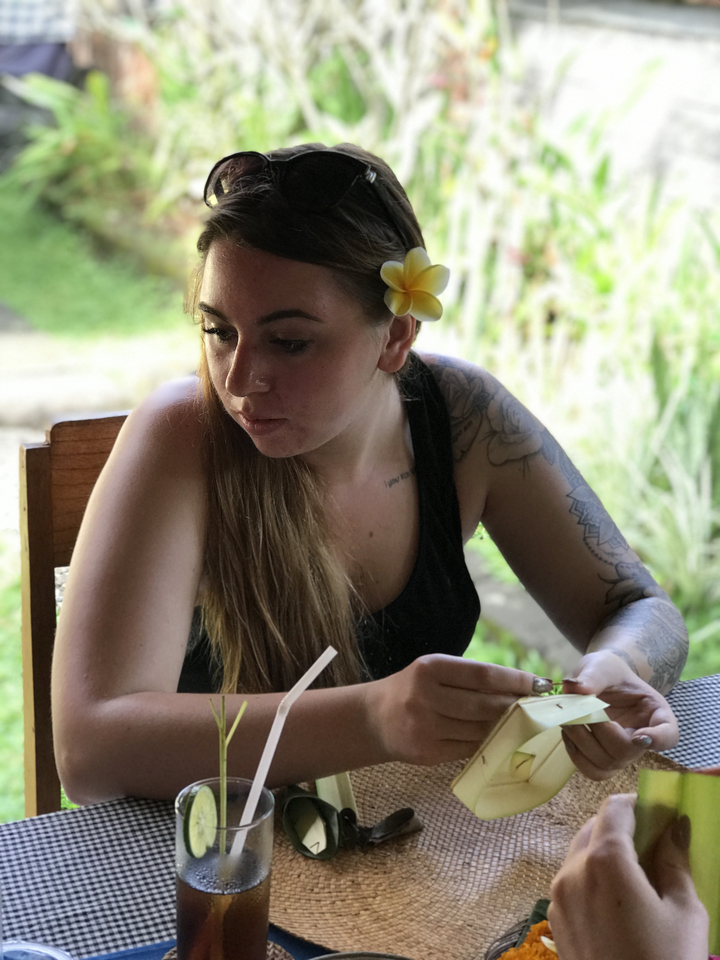 Young woman with a flower in her hair.