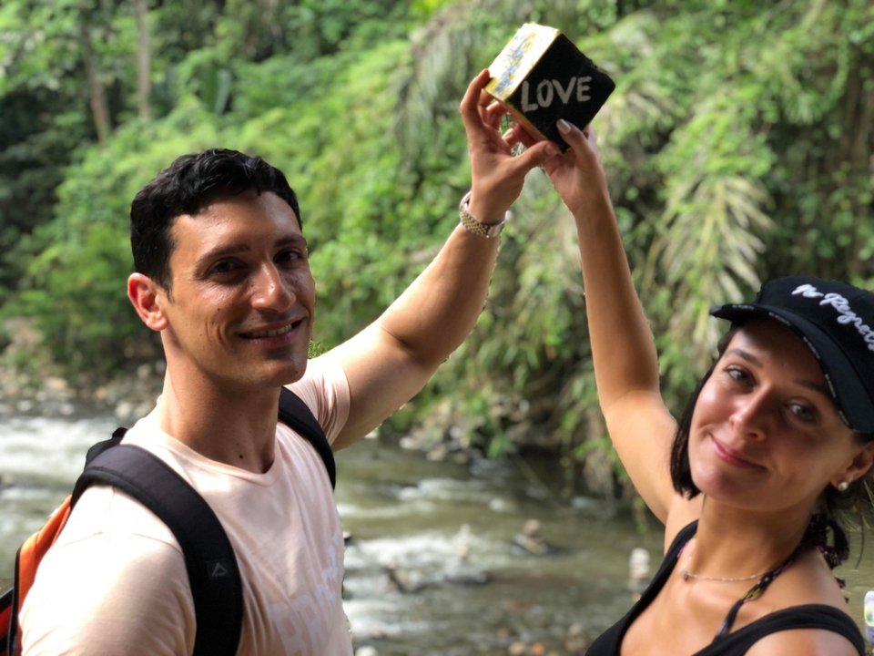 Couple posing by a river.