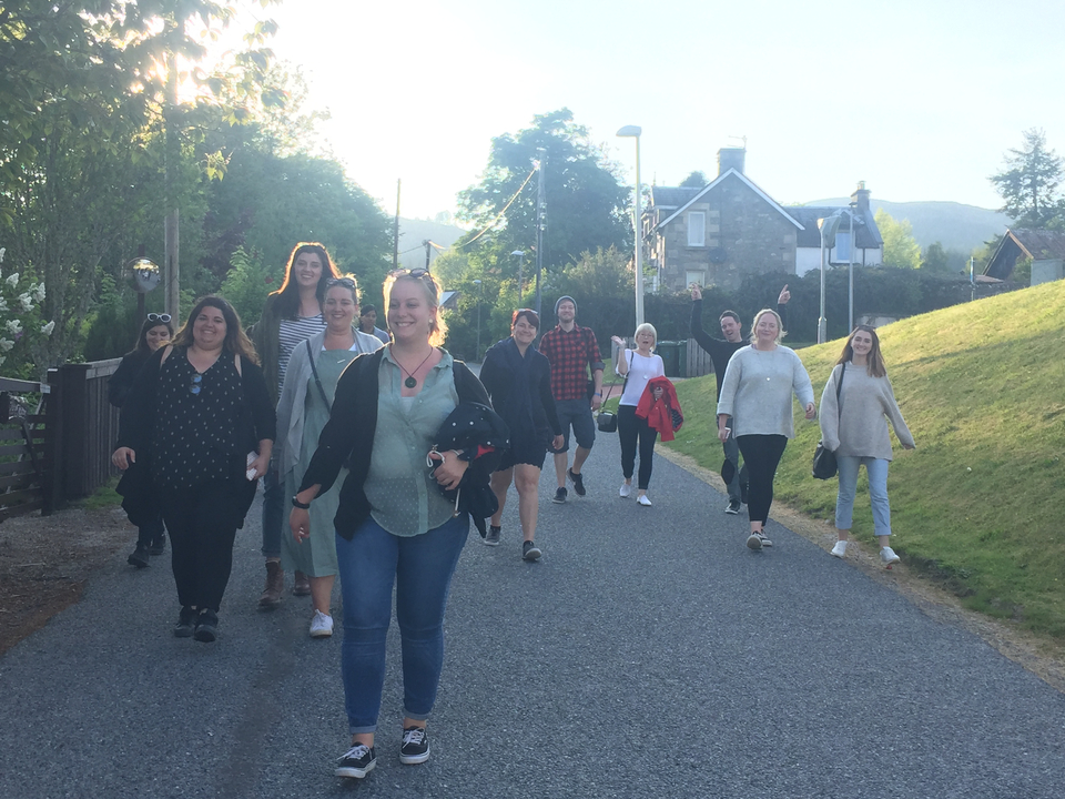 Group walking along a residential street.