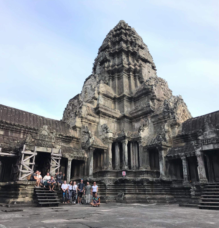 Facade of Angkor Wat temple complex with intricate carvings.