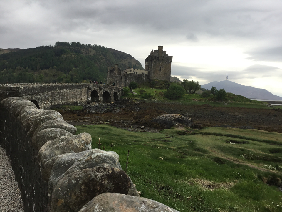 Eilean Donan Castle with surrounding landscape.