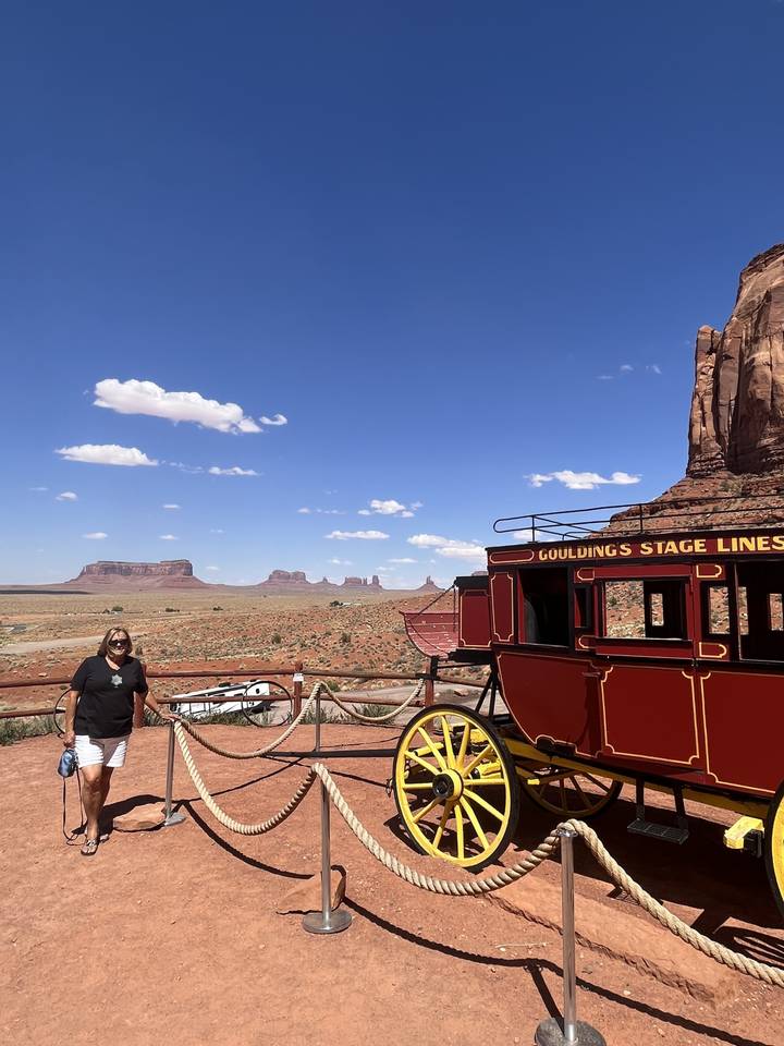 Horse-drawn carriage with Monument Valley in the background.