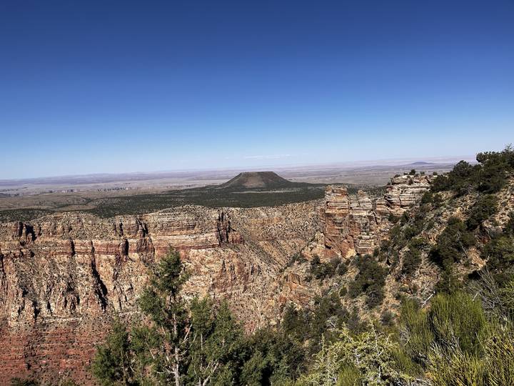 Upside down canyon landscape with clear sky.