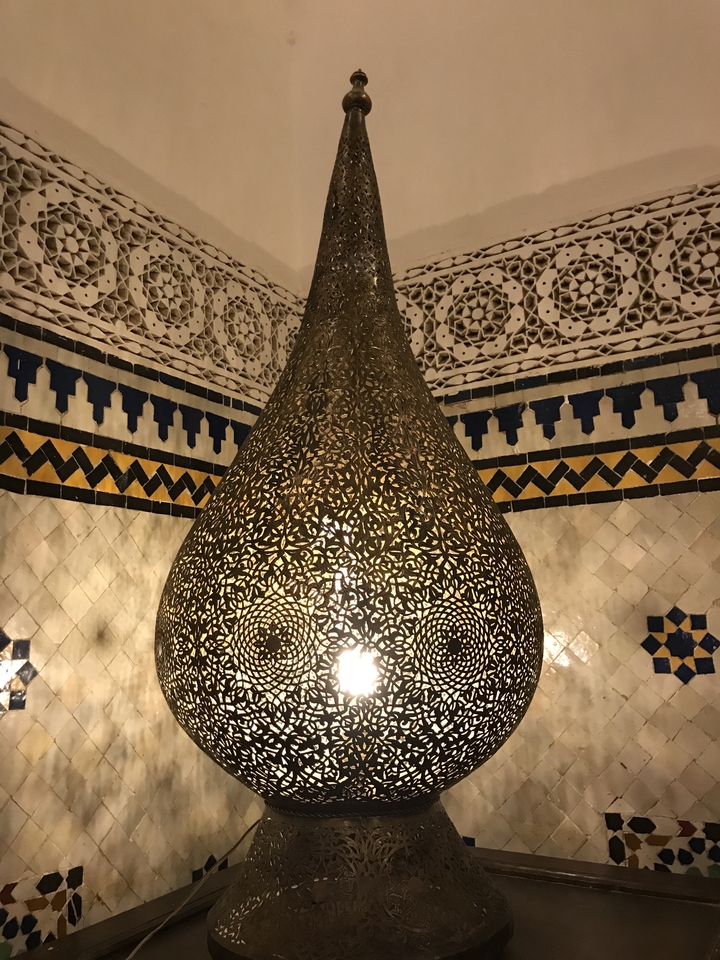 An ornately designed hanging lantern with intricate patterns.