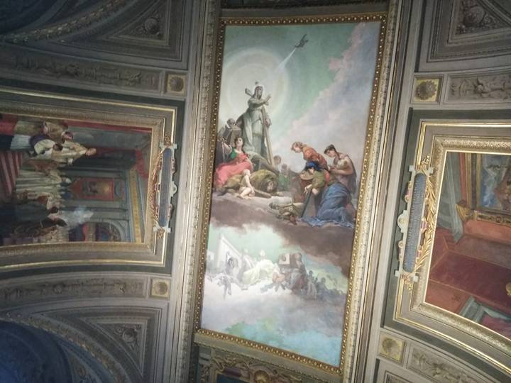 A painted ceiling depicting various figures.