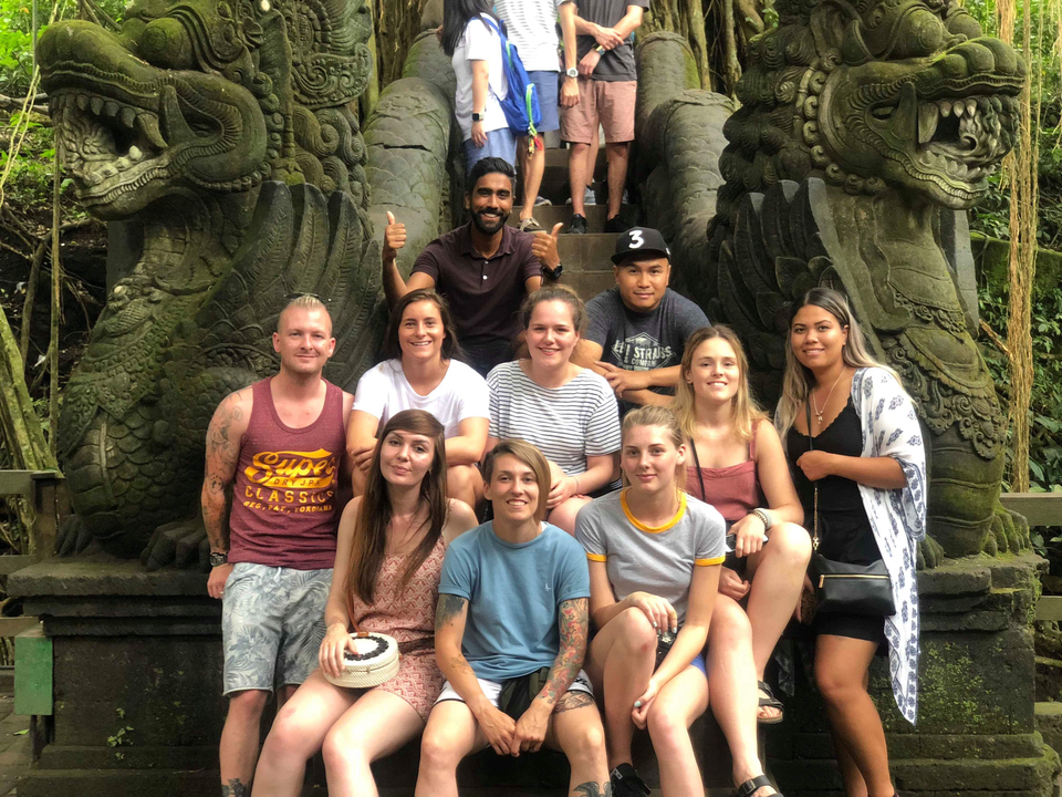 Group photo with stone dragon statues.