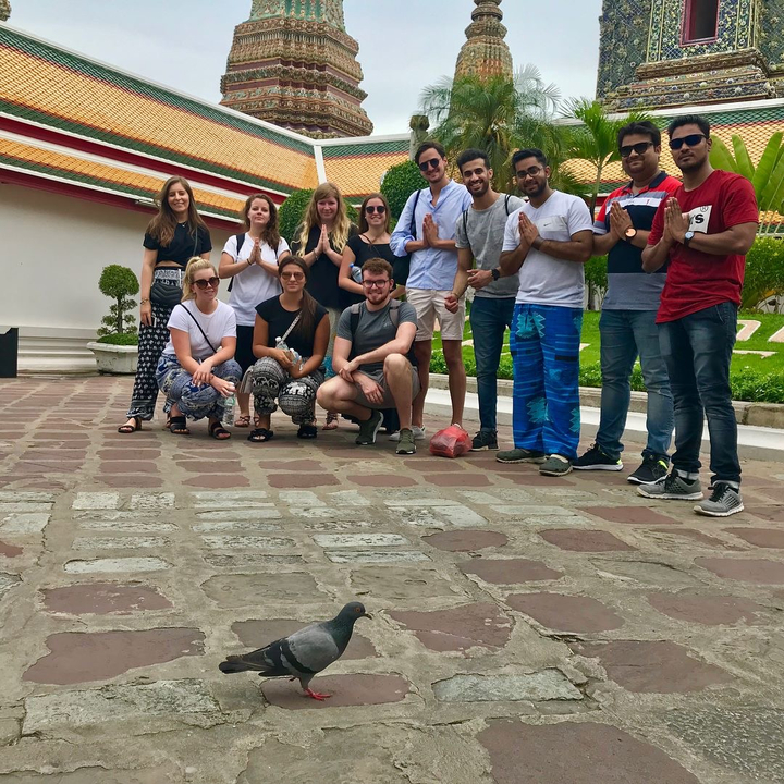 A group of people posing together and smiling.