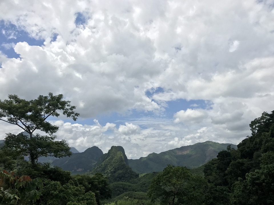 Scenic view of mountains and a cloudy sky.
