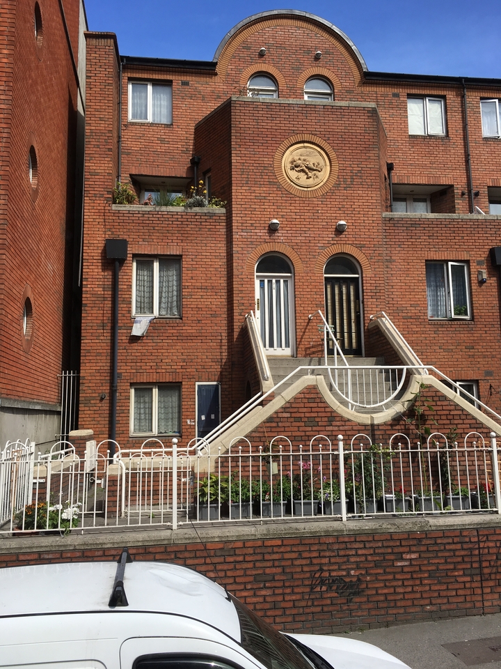 A brick building with unique architecture.