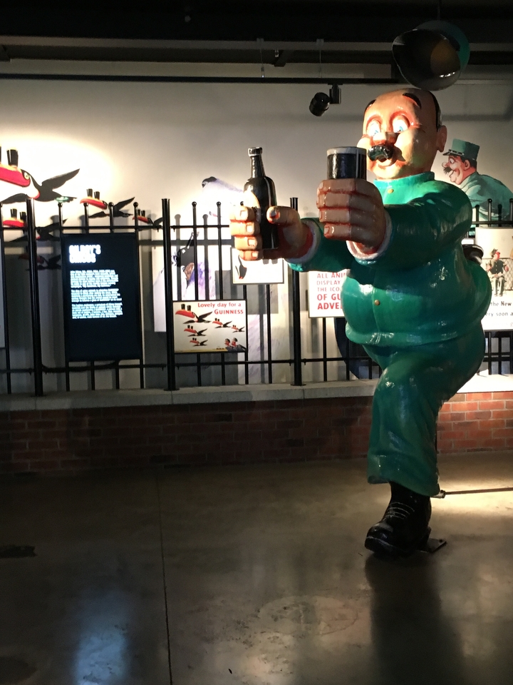 Sculpture of a leprechaun inside a building.