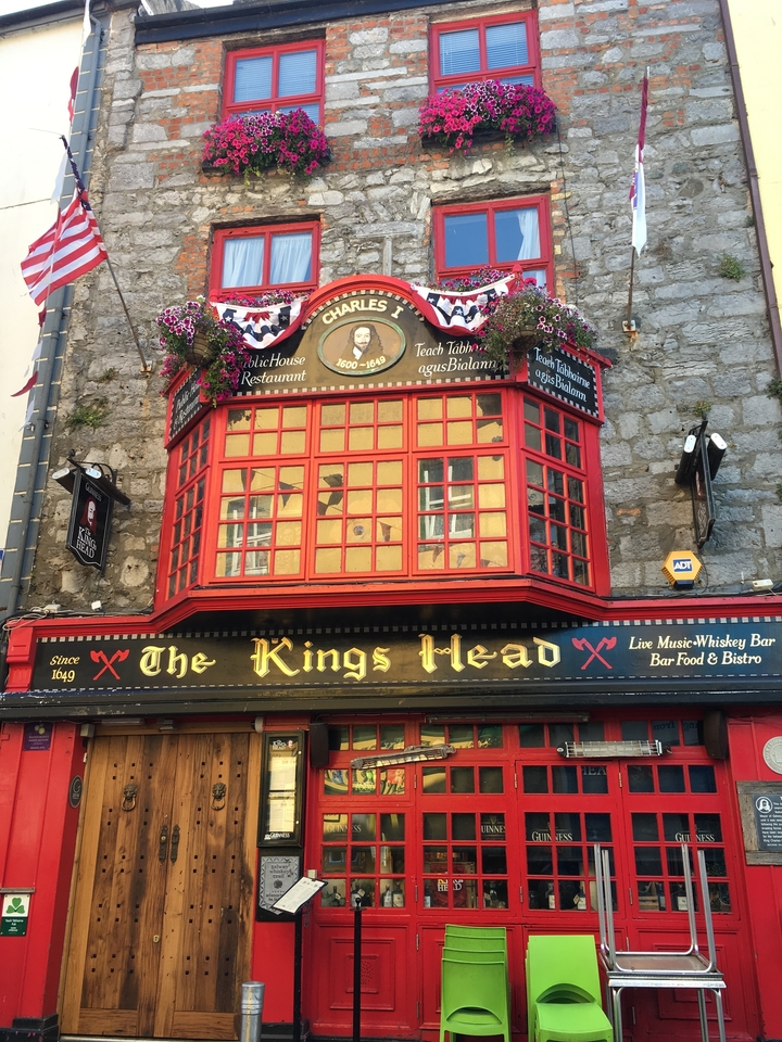 An old pub with decorative signage.