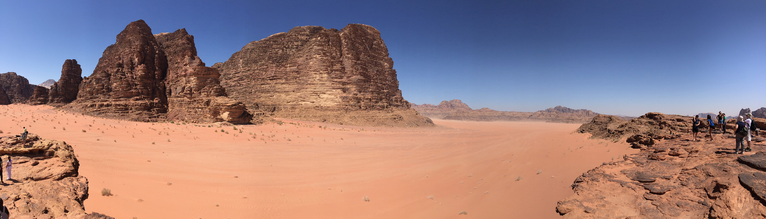 Vast desert landscape with large rock formations.