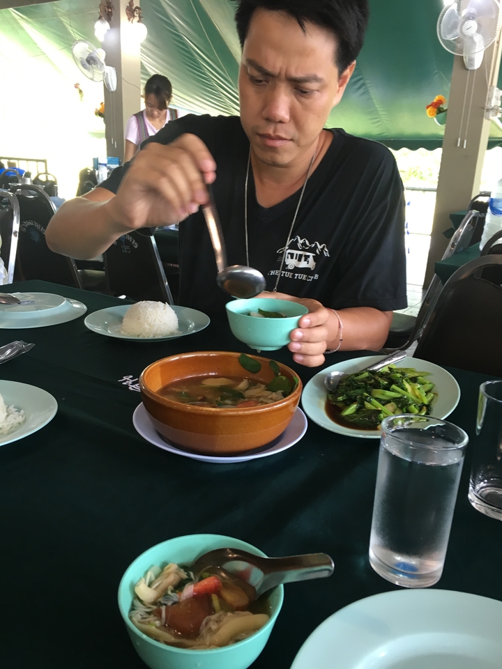 A table set with various dishes, likely a local meal.