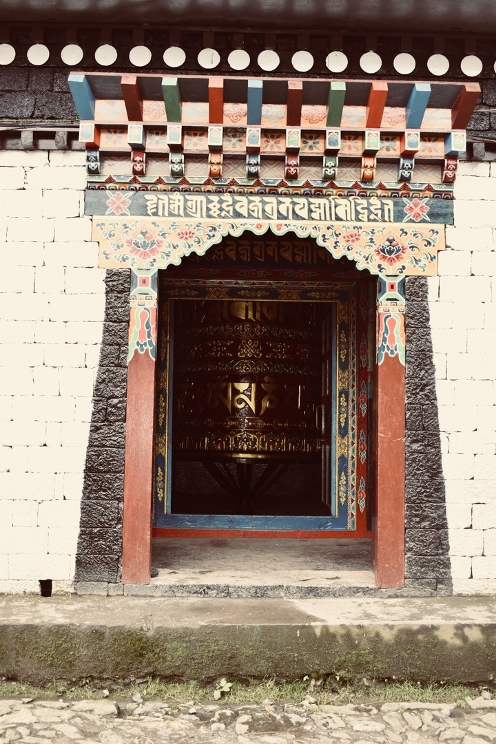 Decorative prayer wheel inside a temple in Nepal.