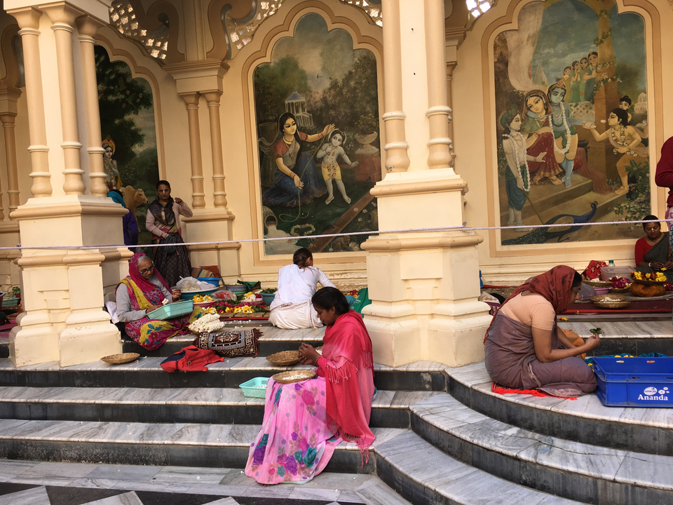 Women preparing offerings at a temple.