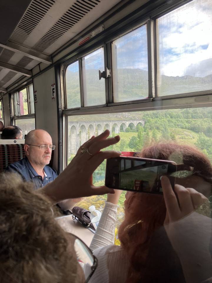 View from inside a train of a scenic landscape.