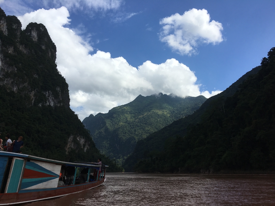 View of large mountain peaks with a river running between them.