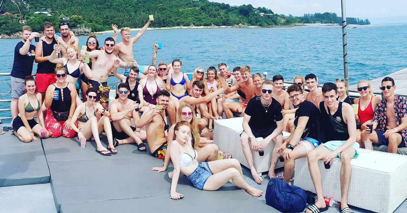 A large group of people enjoying a boat party.