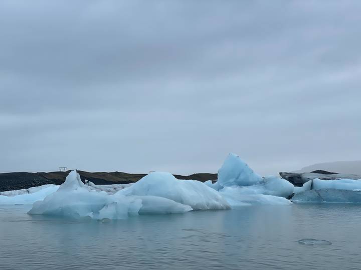 Upside-down view of icebergs floating in a lagoon.