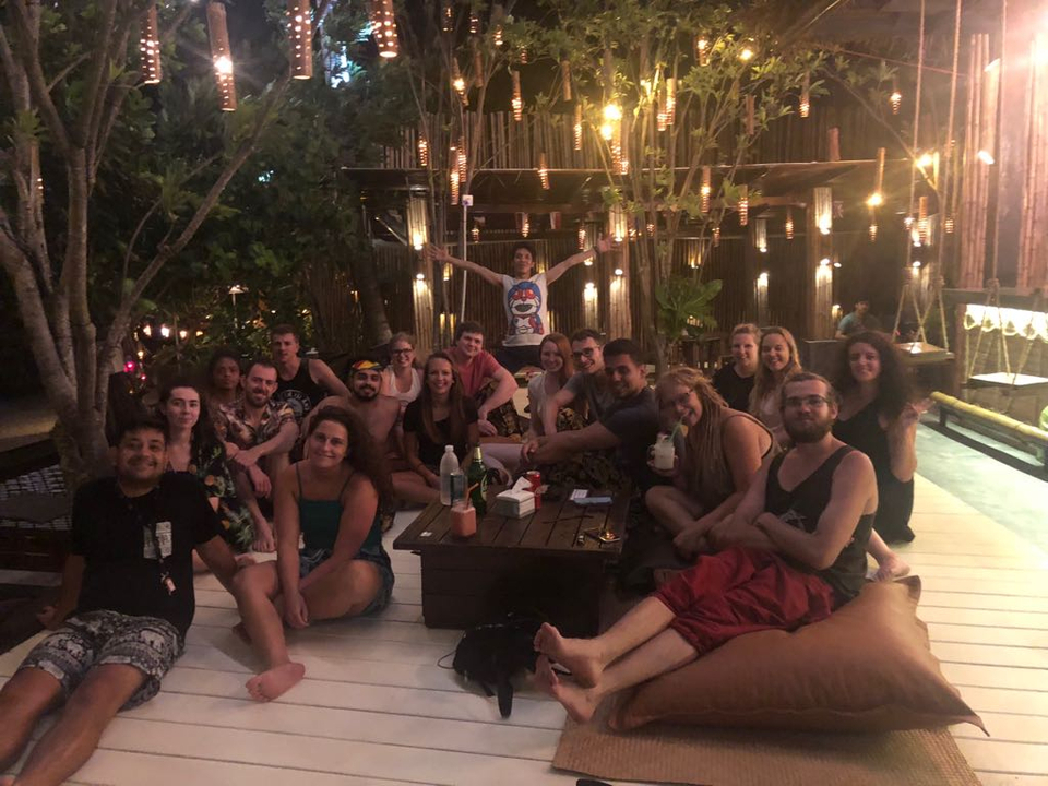 Group of people enjoying a gathering at night.