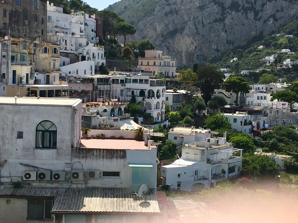 Colorful buildings on a hillside.