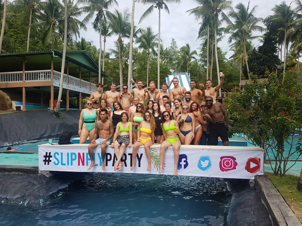 Large group of people posing at a waterpark event.