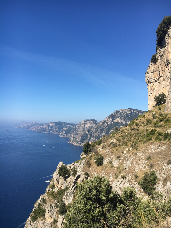 A stunning coastal landscape with rugged cliffs and the sea.