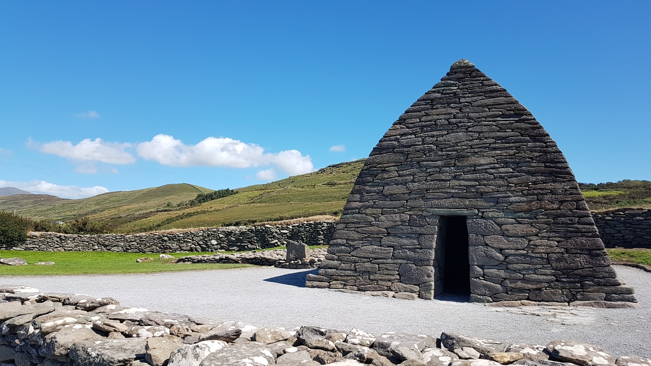 Historic stone building with a blue sky.