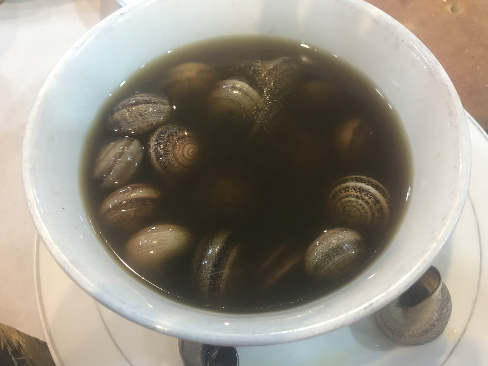 Bowl of snails in broth.