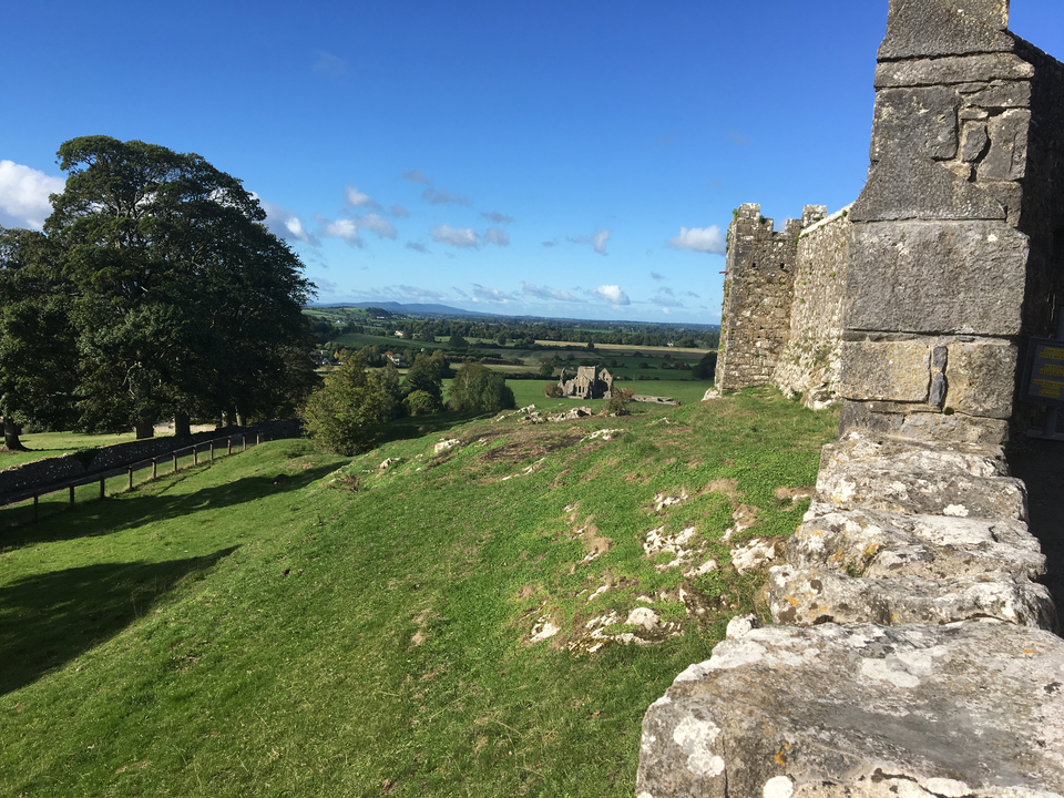 View from the top of a stone edifice looking over the countryside