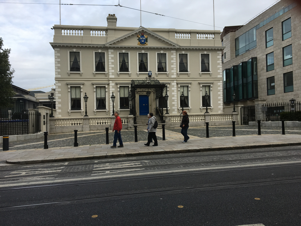 Elegant building with people walking past