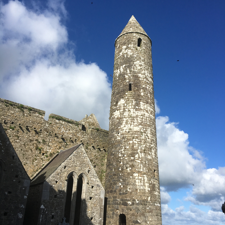 Ancient stone tower against a blue sky