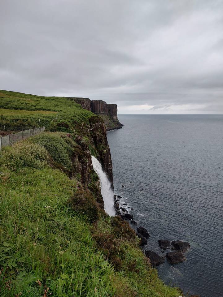 Cliffs and sea view with waves hitting the rocky coast.