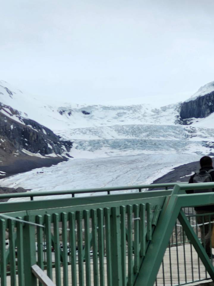 Snowy glacier landscape with visible icy formations.