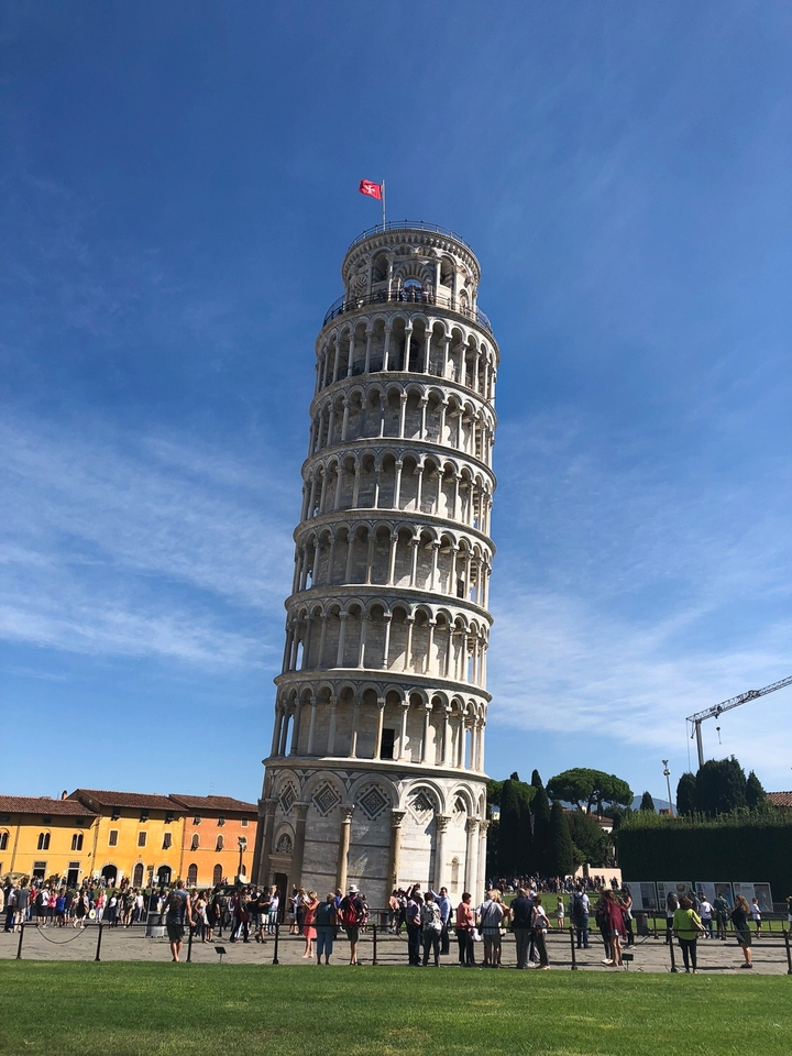 Famous leaning tower against a clear blue sky.
