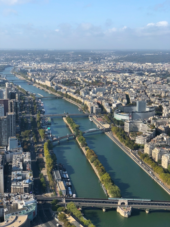Aerial view of a cityscape with river.