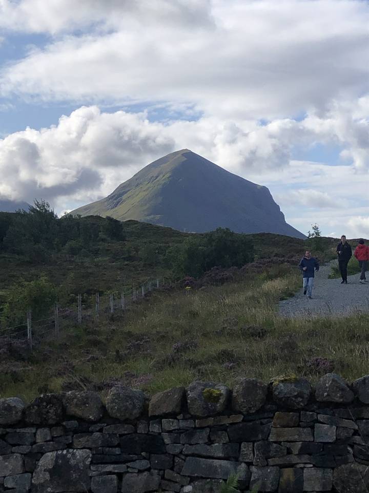 Large mountain peak partially obscured by clouds.
